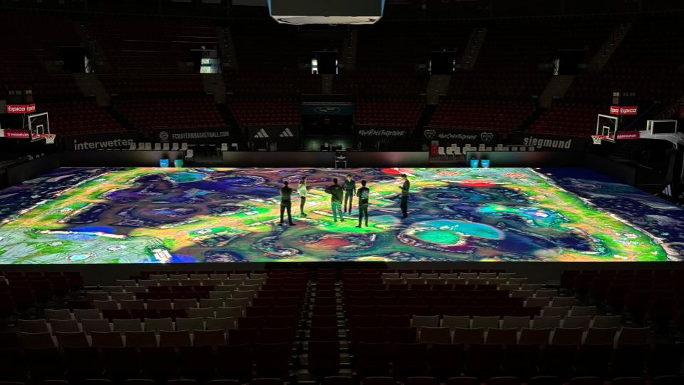 Venue glass-floor activation concept — TFT × League of Legends